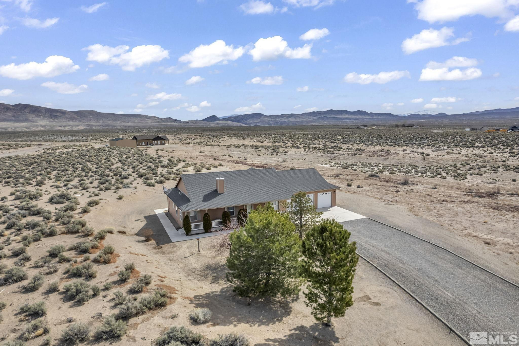 67 Desert View Drive Smith Valley, NV 89430 - Photo 11 of 36 a view of a lake with a building in the background