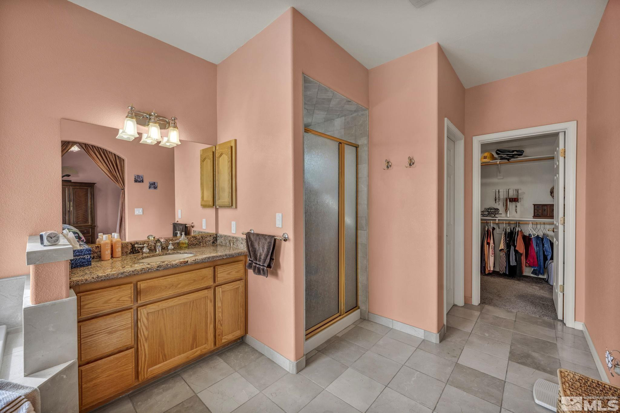 67 Desert View Drive Smith Valley, NV 89430 - Photo 16 of 36 a spacious bathroom with a double vanity sink and a mirror