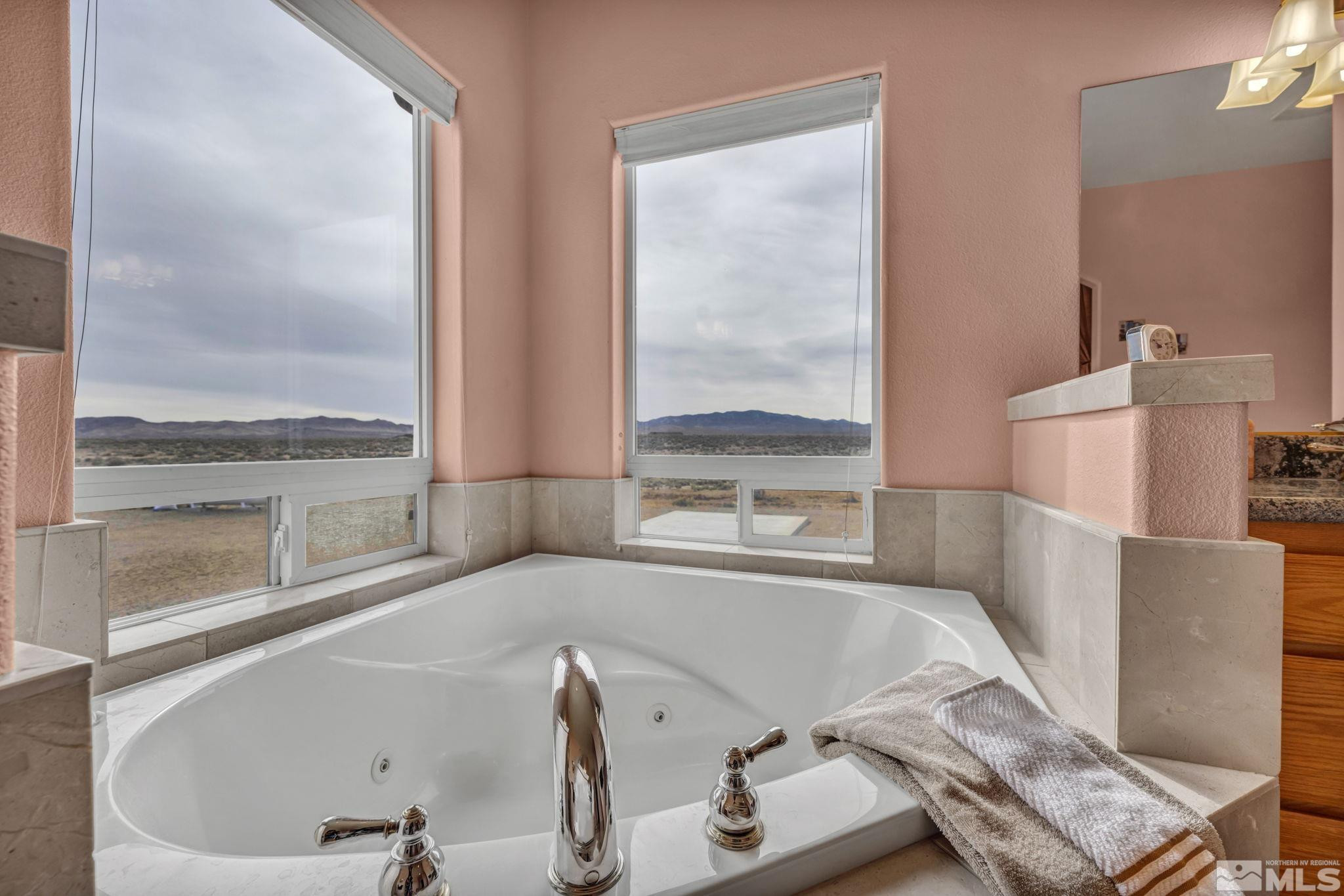 67 Desert View Drive Smith Valley, NV 89430 - Photo 17 of 36 a bath tub sitting next to a window