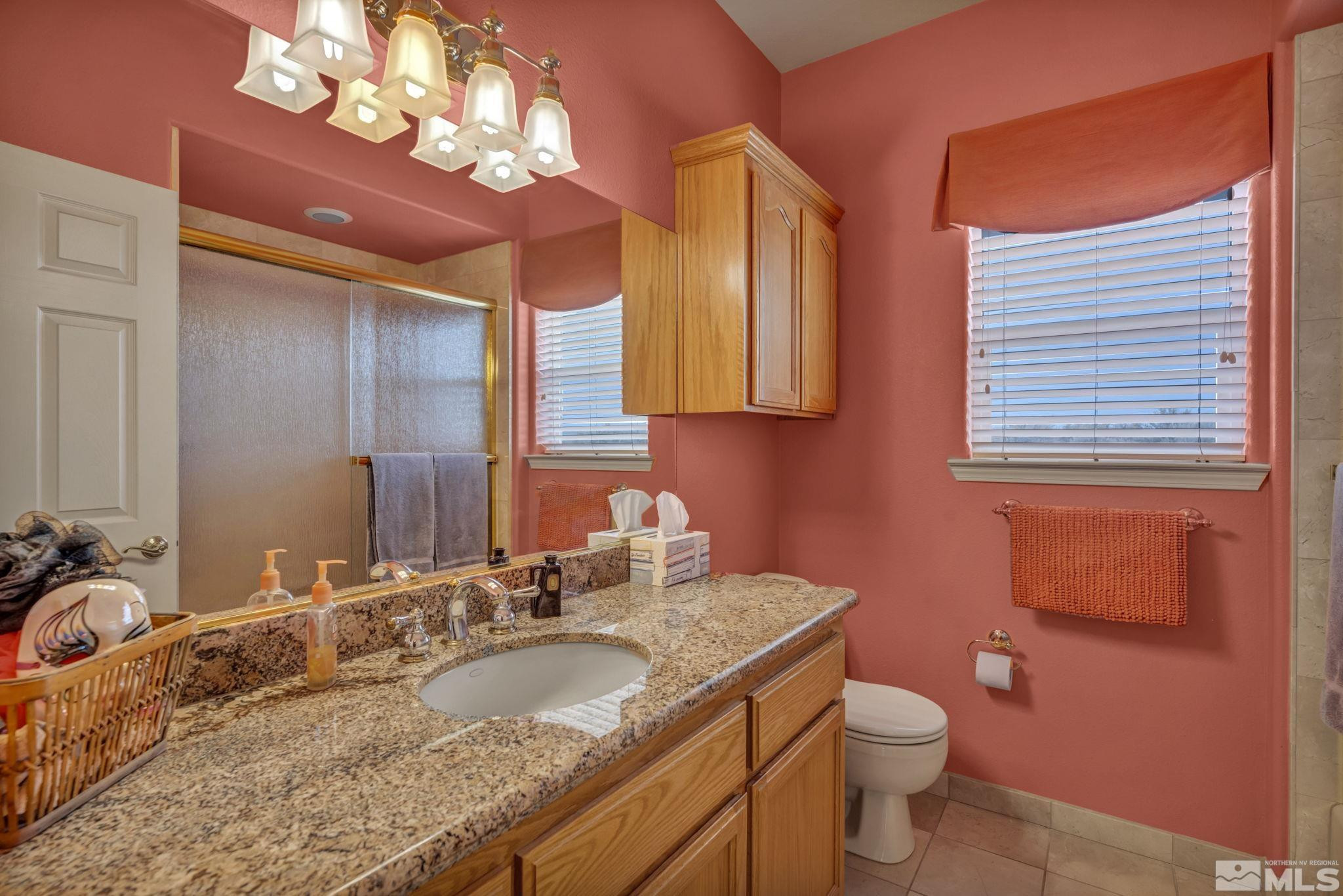 67 Desert View Drive Smith Valley, NV 89430 - Photo 22 of 36 a bathroom with a granite countertop double vanity sink and a mirror