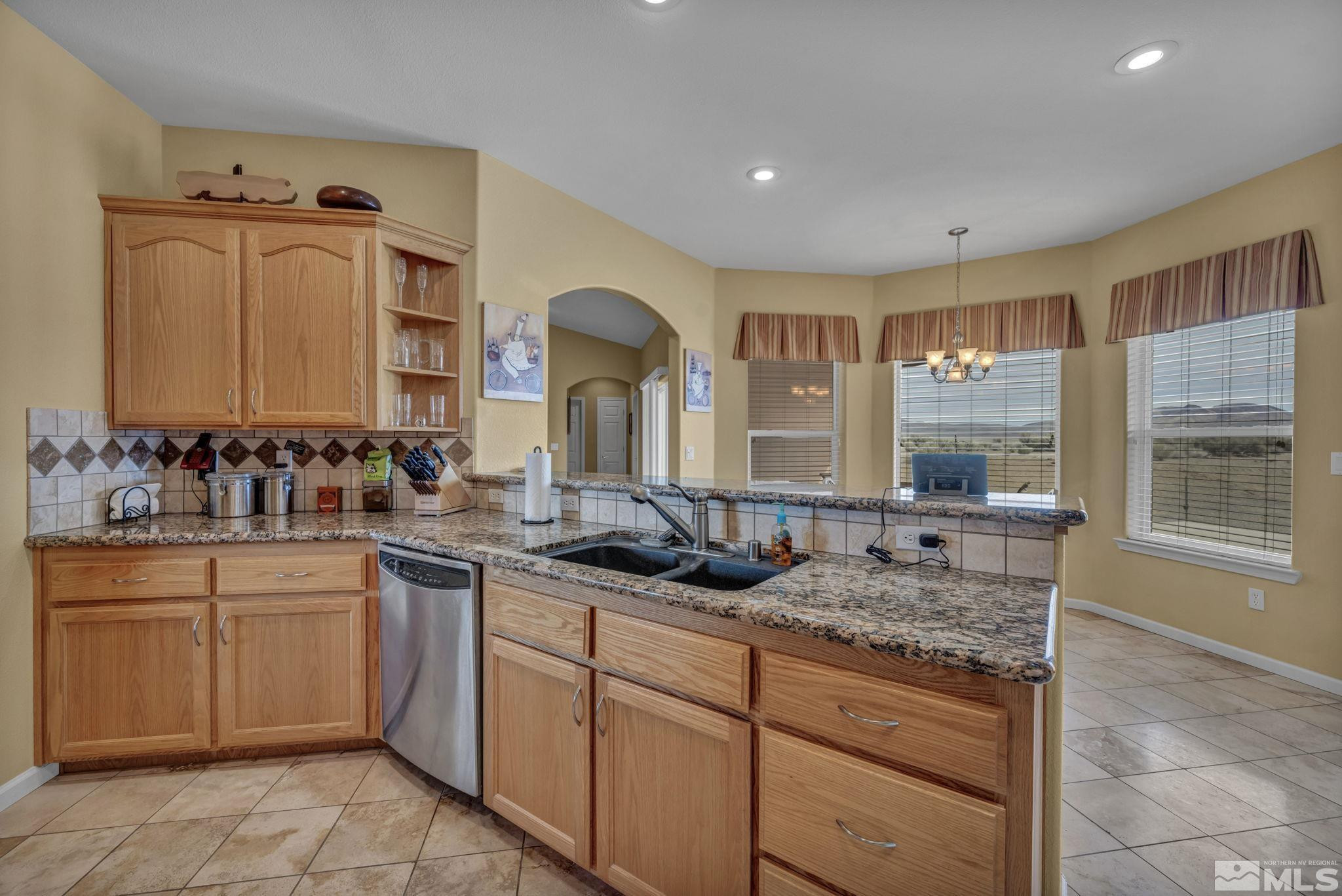 67 Desert View Drive Smith Valley, NV 89430 - Photo 31 of 36 a bathroom with a granite countertop sink mirror and