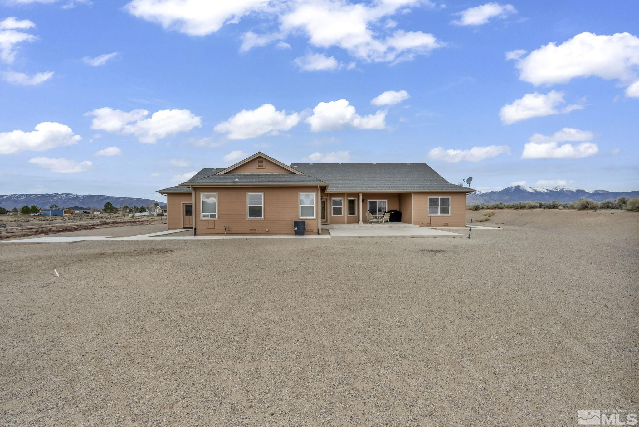 67 Desert View Drive Smith Valley, NV 89430 - Photo 6 of 36 a front view of a house with a yard and lake view