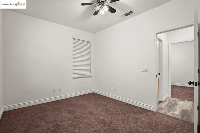 a kitchen with granite countertop stainless steel appliances a sink and counter space