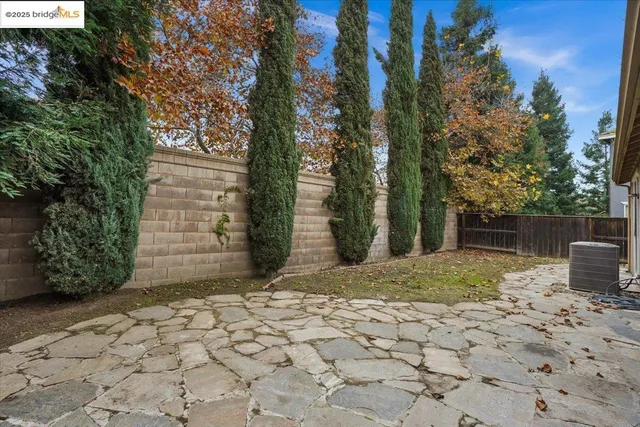 an empty room with a ceiling fan