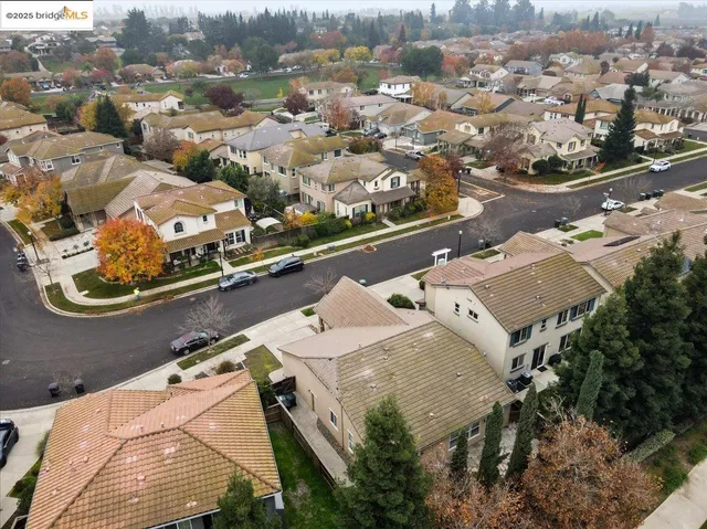 a bathroom with a granite countertop sink and a large mirror