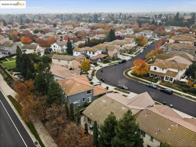 an aerial view of a house with yard