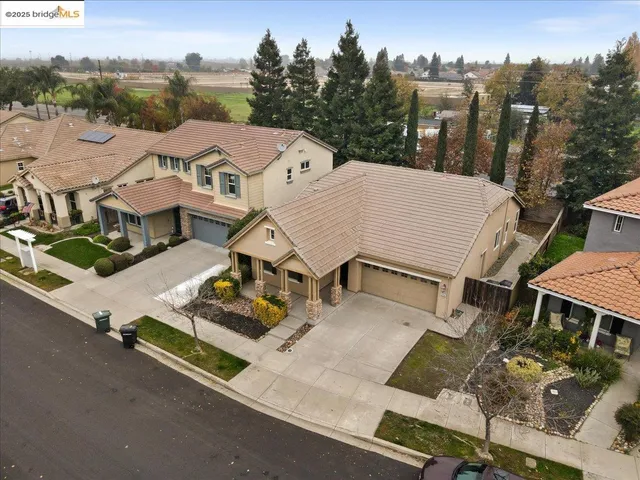 an aerial view of a house with roof deck