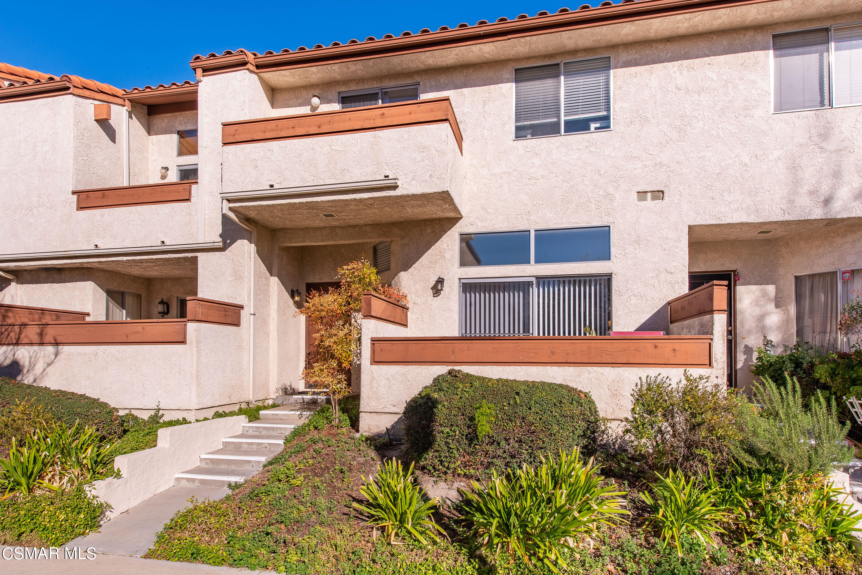 1736 Sinaloa Road, Unit 315 Simi Valley, CA 93065 - Photo 1 of 31 a front view of a house with a yard
