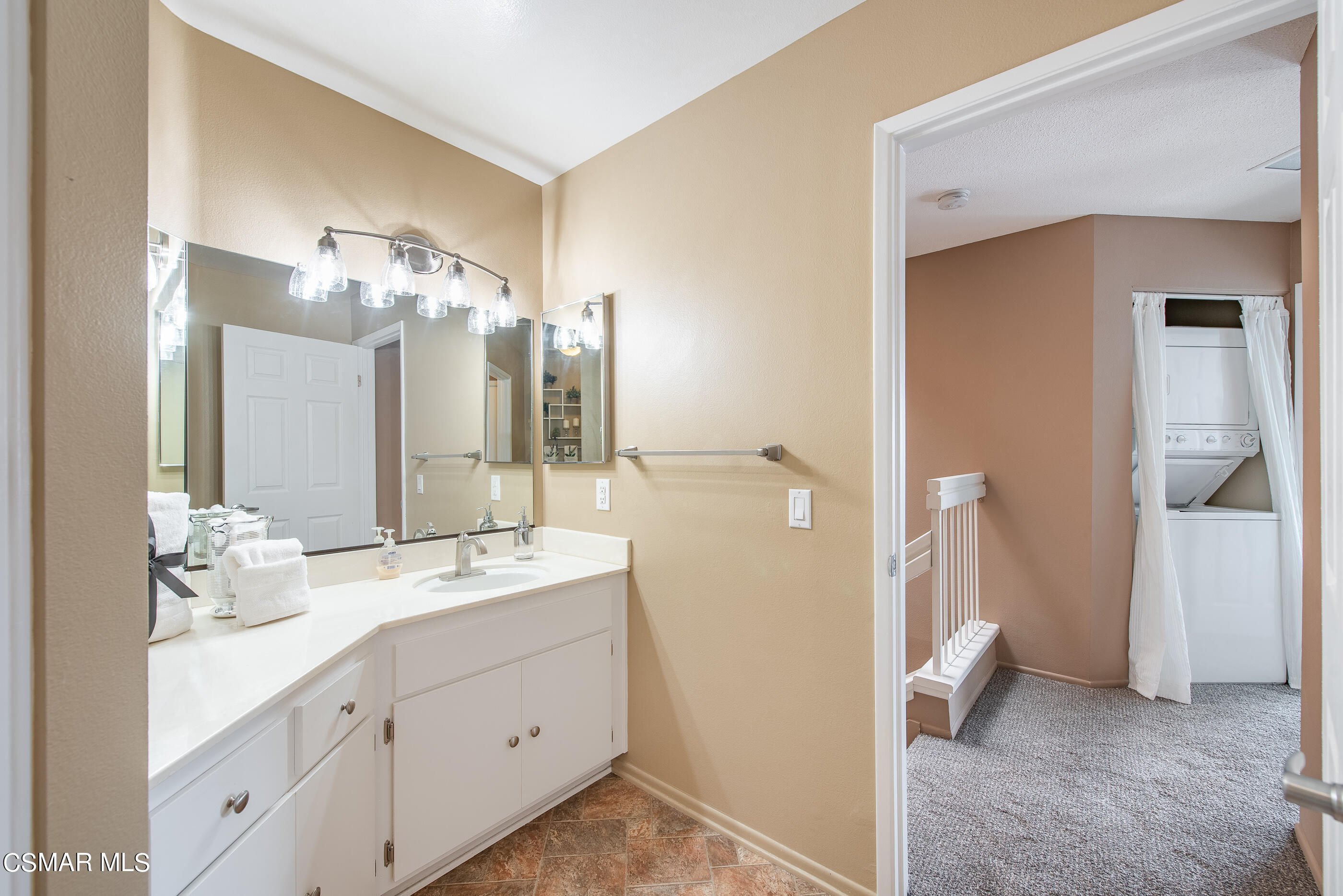 1736 Sinaloa Road, Unit 315 Simi Valley, CA 93065 - Photo 17 of 31 a spacious bathroom with a double vanity sink a mirror and shower