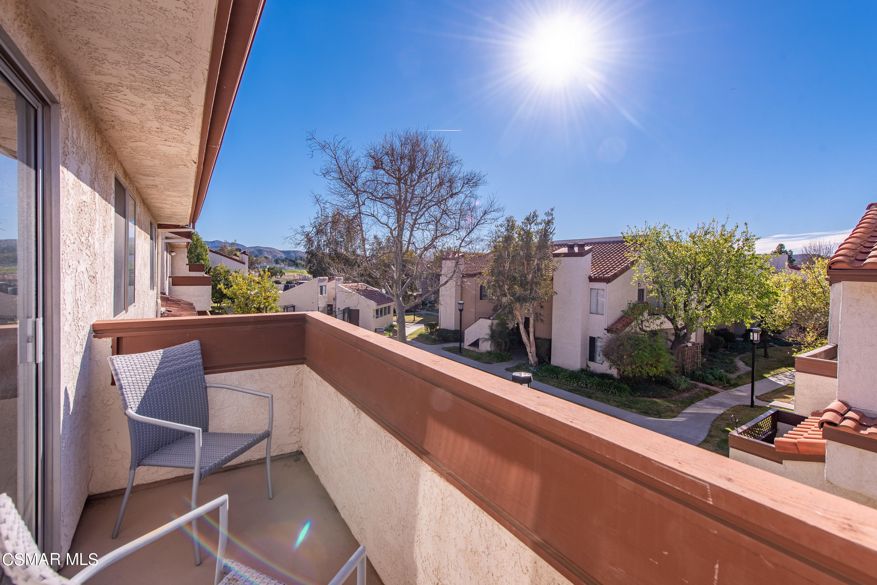 1736 Sinaloa Road, Unit 315 Simi Valley, CA 93065 - Photo 19 of 31 a view of balcony with two chairs and a table