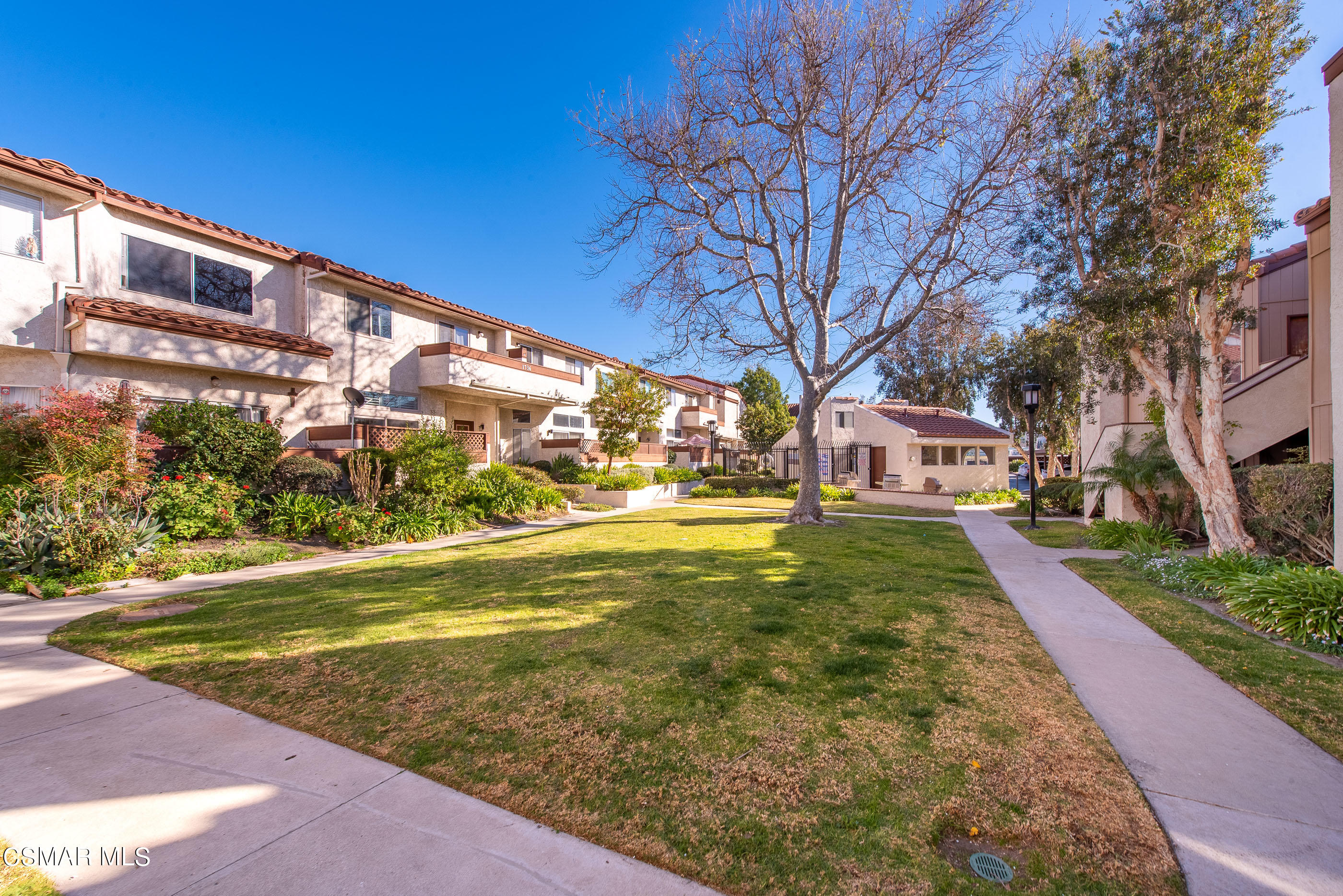 1736 Sinaloa Road, Unit 315 Simi Valley, CA 93065 - Photo 23 of 31 a view of a big yard next to a building