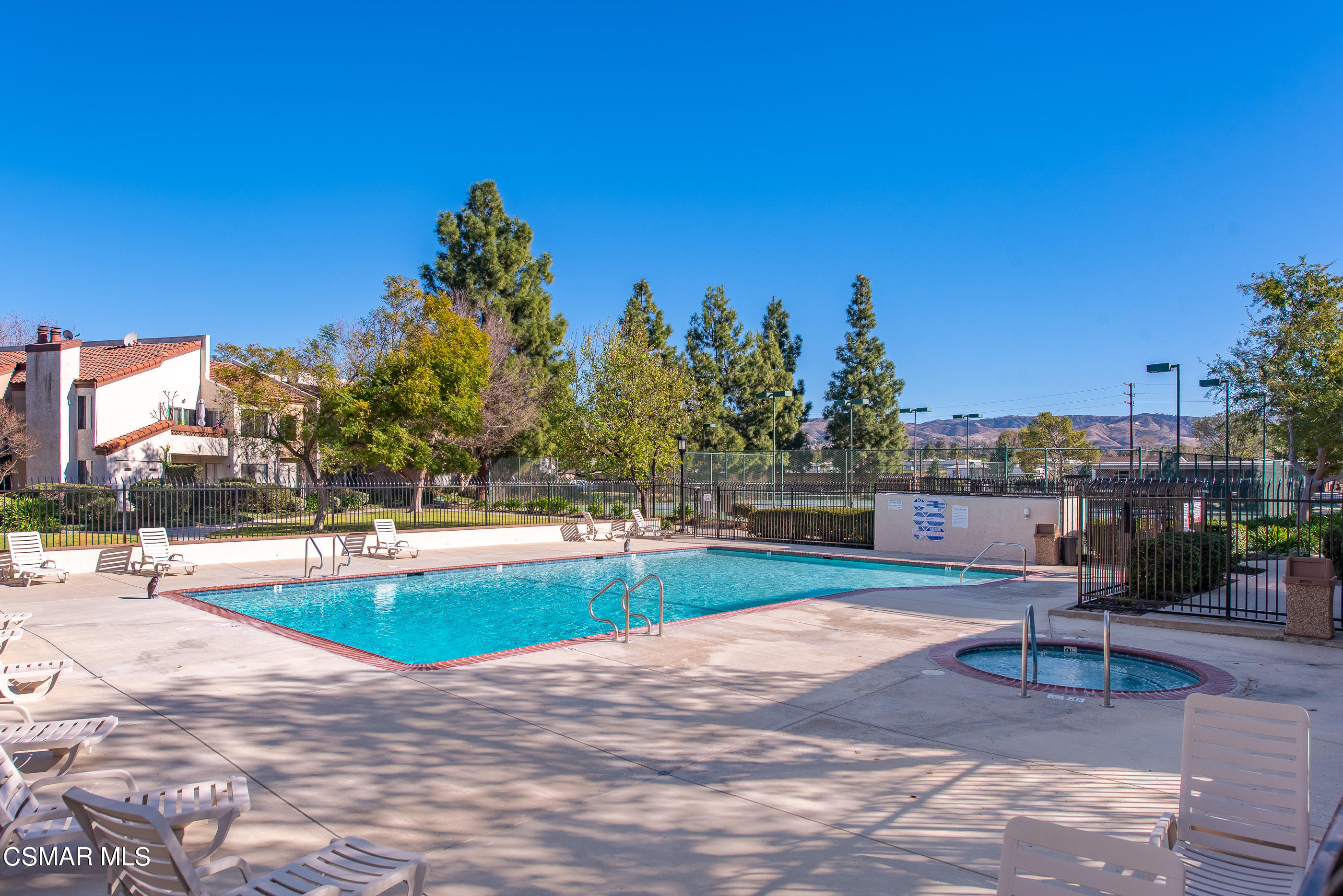 1736 Sinaloa Road, Unit 315 Simi Valley, CA 93065 - Photo 24 of 31 a view of a swimming pool and lounge chairs