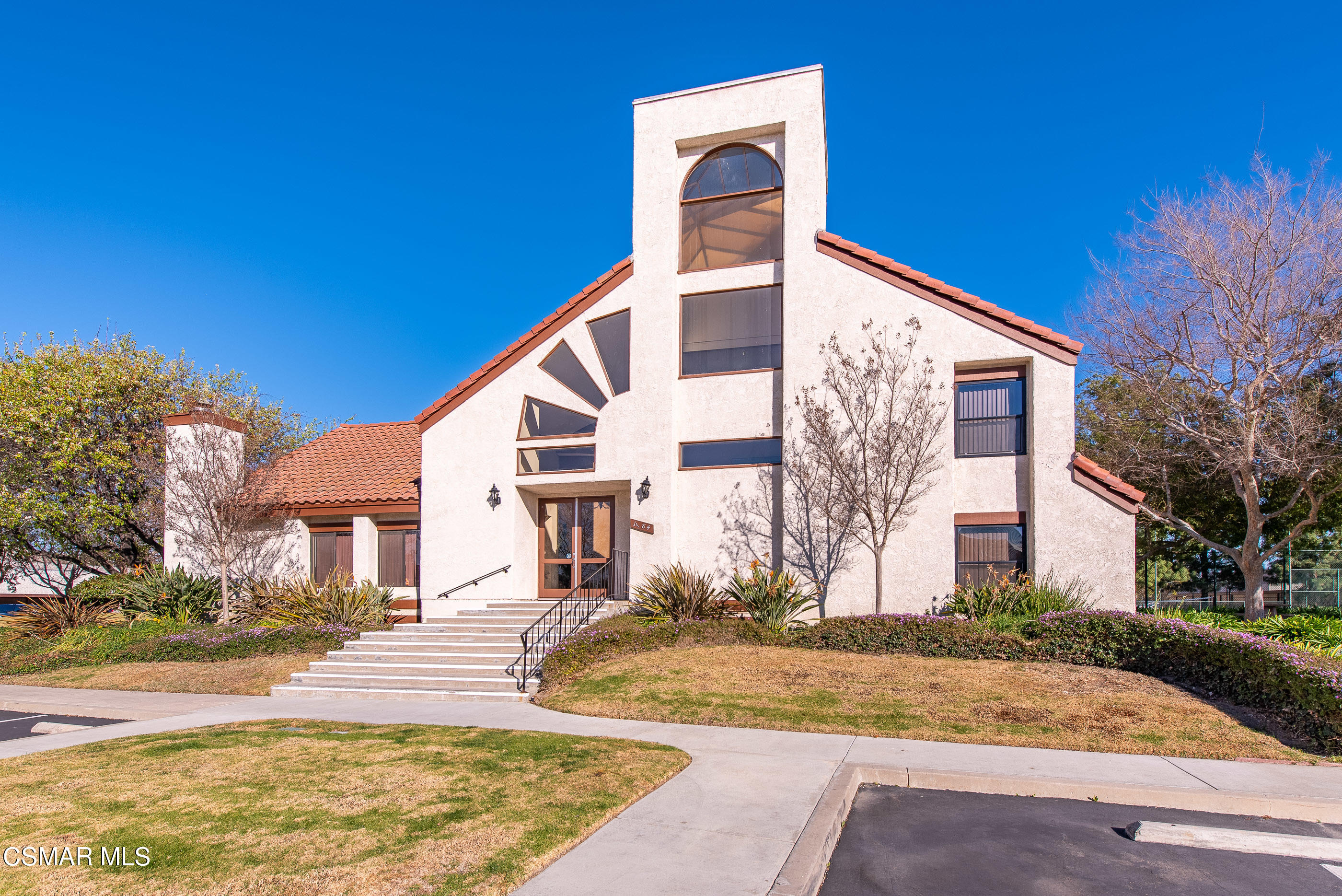 1736 Sinaloa Road, Unit 315 Simi Valley, CA 93065 - Photo 25 of 31 a view of a white house with a large trees