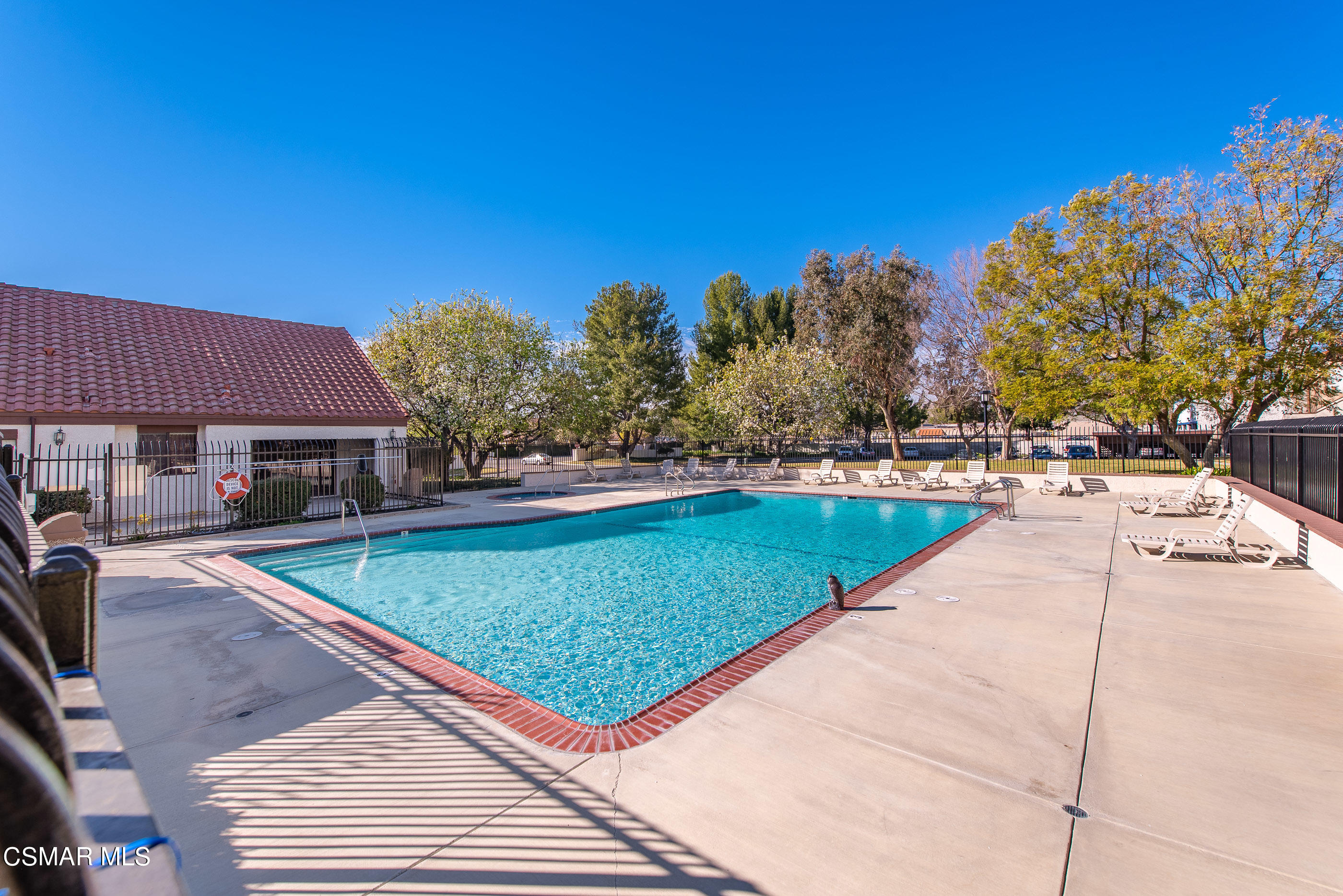 1736 Sinaloa Road, Unit 315 Simi Valley, CA 93065 - Photo 26 of 31 a view of a swimming pool and a yard