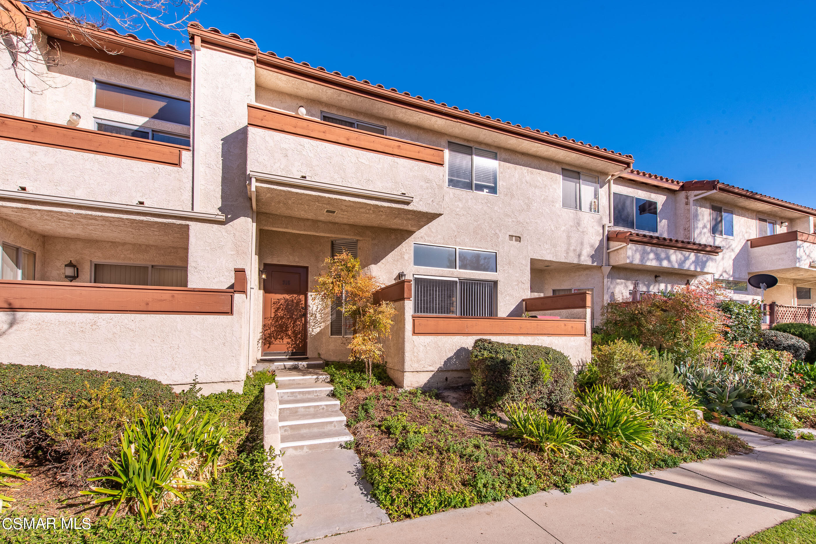 1736 Sinaloa Road, Unit 315 Simi Valley, CA 93065 - Photo 30 of 31 a front view of a house with a yard