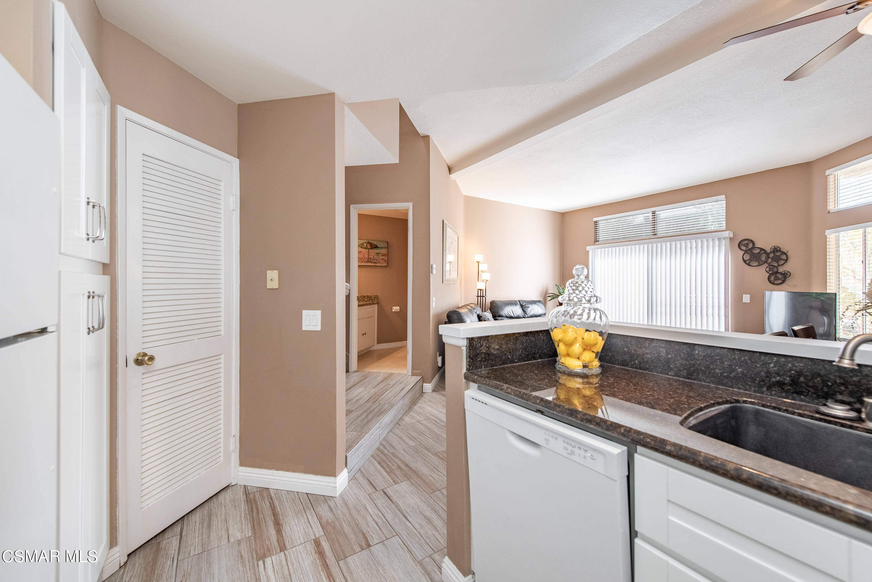 1736 Sinaloa Road, Unit 315 Simi Valley, CA 93065 - Photo 9 of 31 a kitchen with a sink and a refrigerator