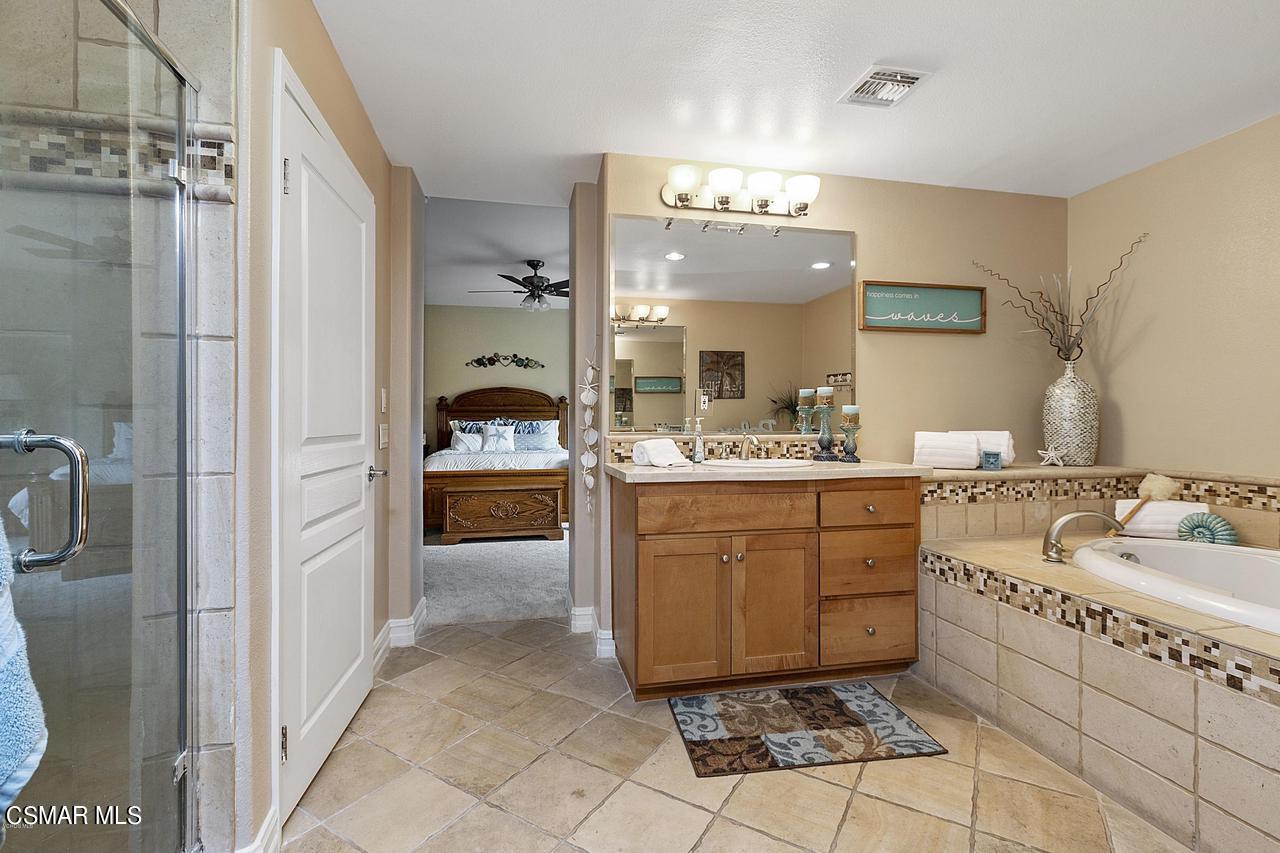 1501 Windshore Way Oxnard, CA 93035 - Photo 16 of 24 a bathroom with a sink vanity and mirror