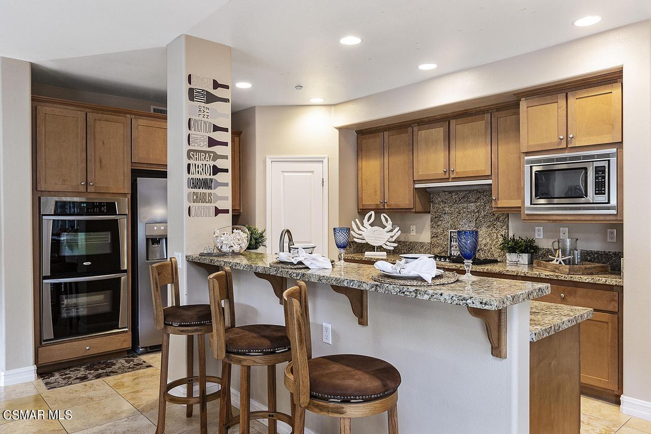 1501 Windshore Way Oxnard, CA 93035 - Photo 6 of 24 a kitchen with a sink stove and refrigerator