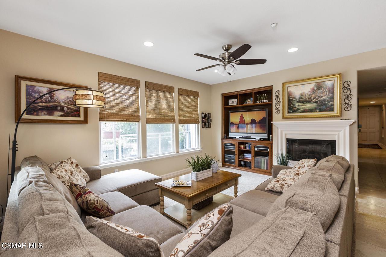 1501 Windshore Way Oxnard, CA 93035 - Photo 10 of 24 a living room with furniture large window and a fireplace