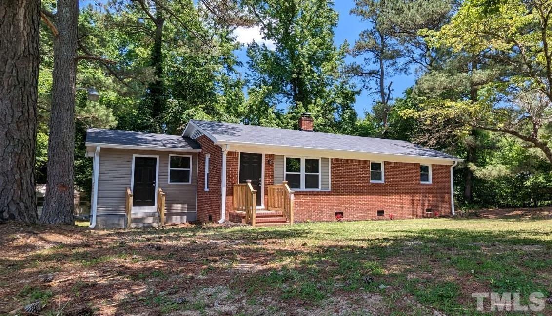 front view of a house with a yard