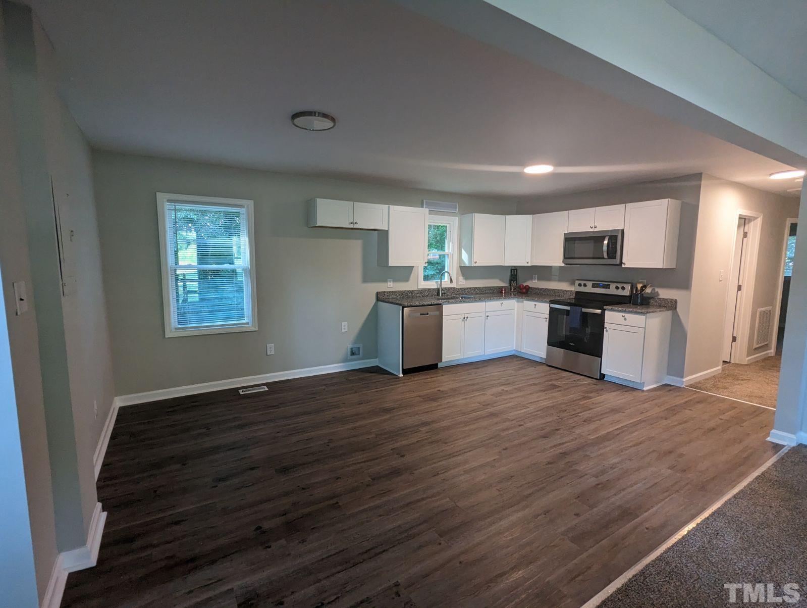 30 Alton Acres Subdivision Road Louisburg, NC 27549 - Photo 11 of 35 a kitchen with granite countertop a stove and a sink