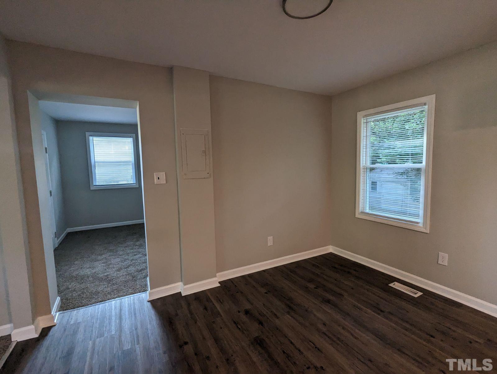 30 Alton Acres Subdivision Road Louisburg, NC 27549 - Photo 16 of 35 a view of an empty room with wooden floor and a window
