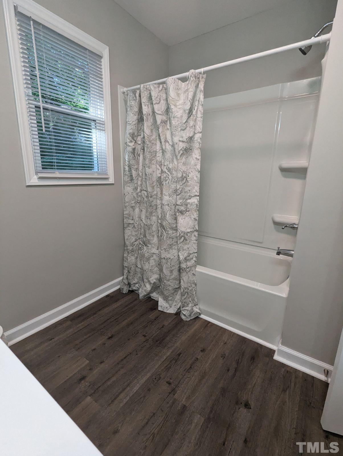 30 Alton Acres Subdivision Road Louisburg, NC 27549 - Photo 26 of 35 a bathroom with a bathtub and a shower