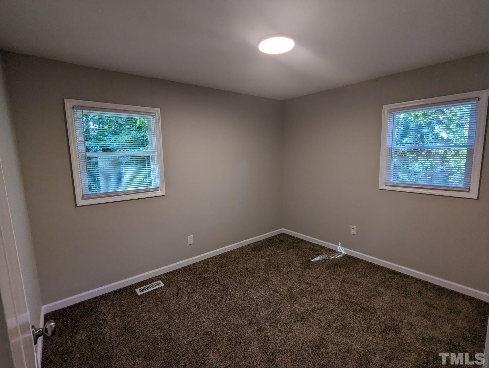 30 Alton Acres Subdivision Road Louisburg, NC 27549 - Photo 29 of 35 an empty room with windows
