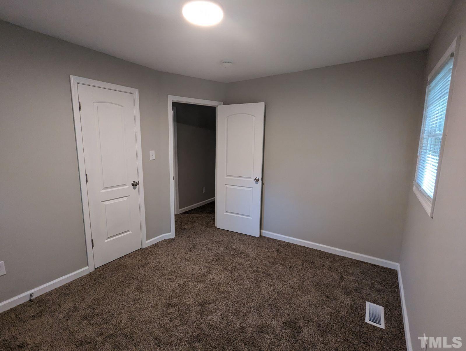 30 Alton Acres Subdivision Road Louisburg, NC 27549 - Photo 30 of 35 an empty room with closet