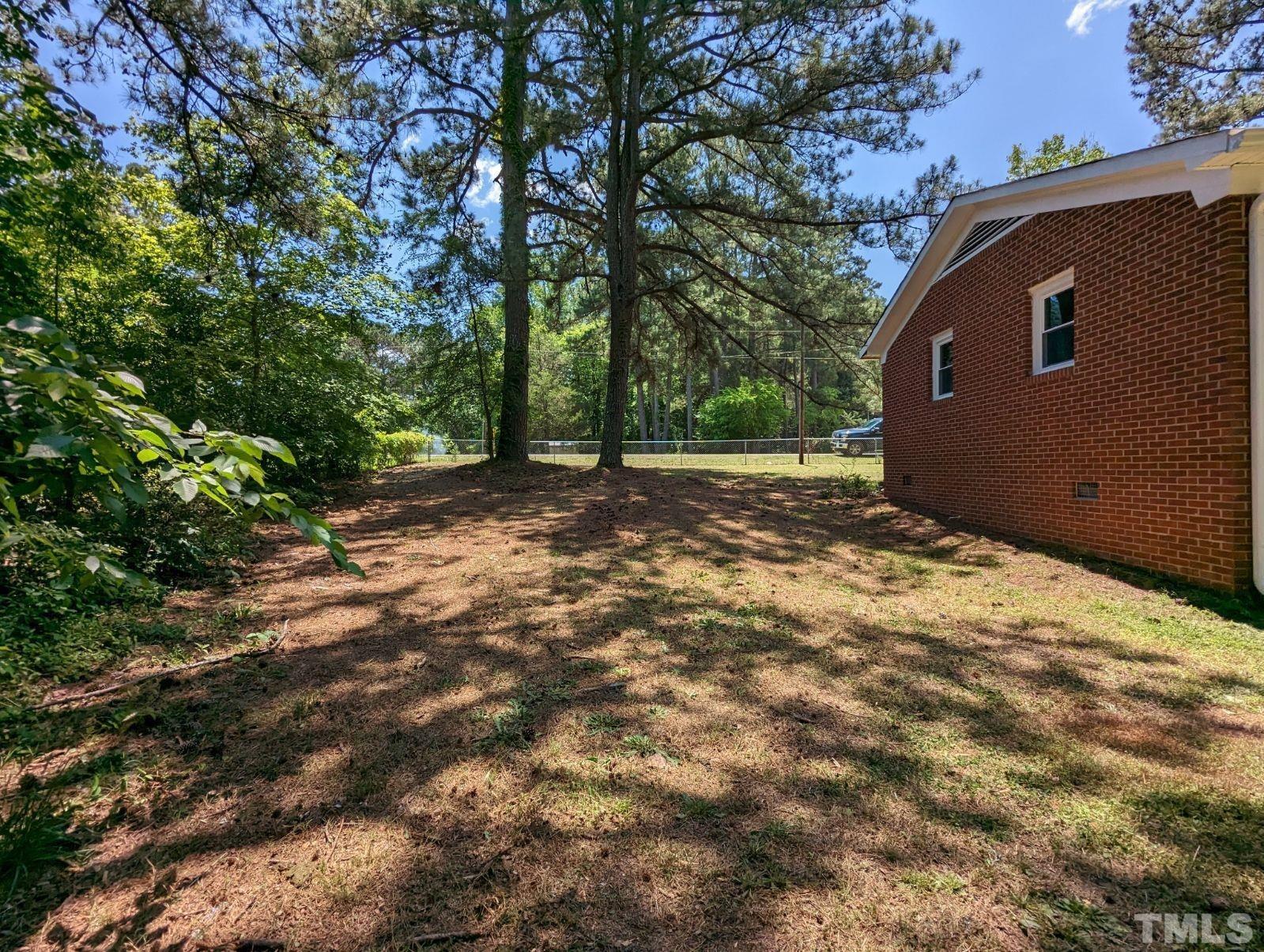 30 Alton Acres Subdivision Road Louisburg, NC 27549 - Photo 33 of 35 a front view of a house with a yard