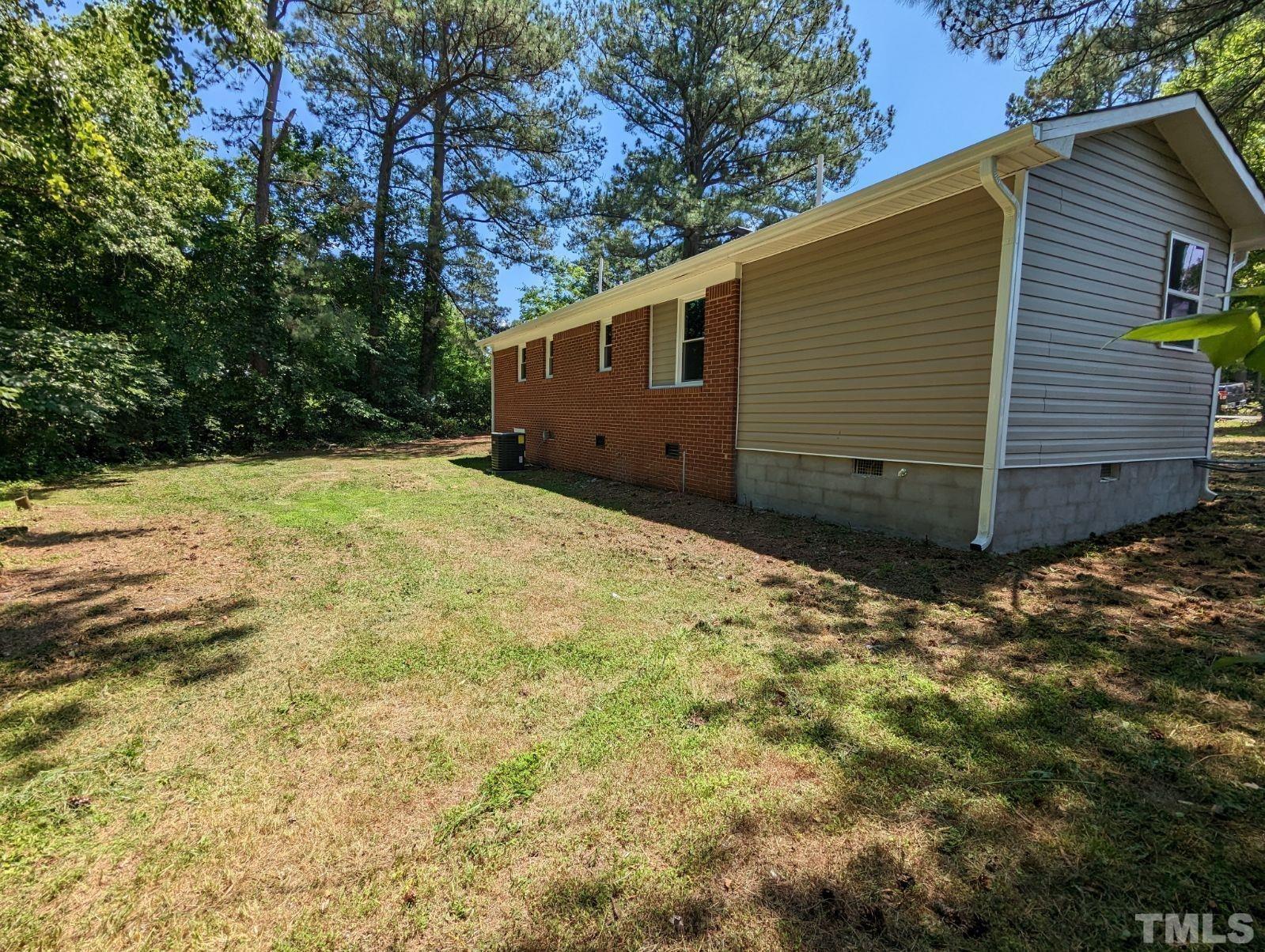 30 Alton Acres Subdivision Road Louisburg, NC 27549 - Photo 34 of 35 a view of a backyard of the house