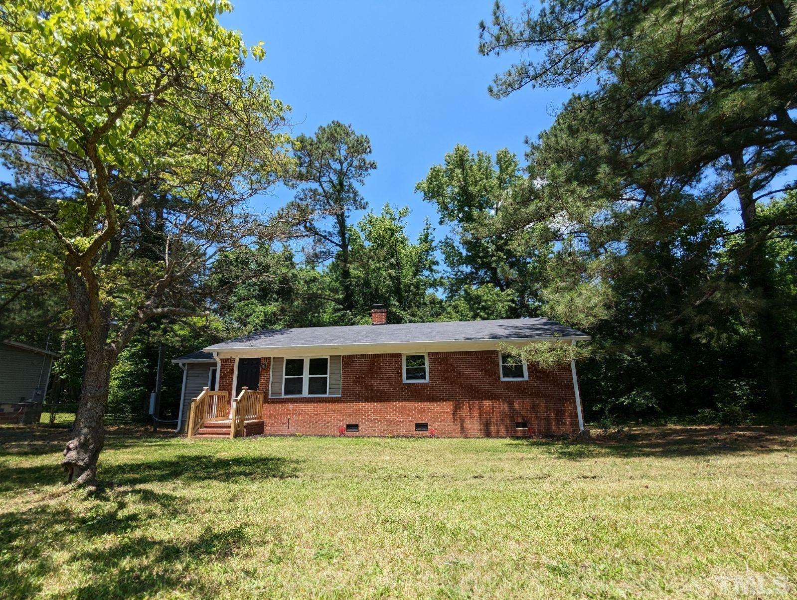 30 Alton Acres Subdivision Road Louisburg, NC 27549 - Photo 4 of 35 a front view of a house with a garden