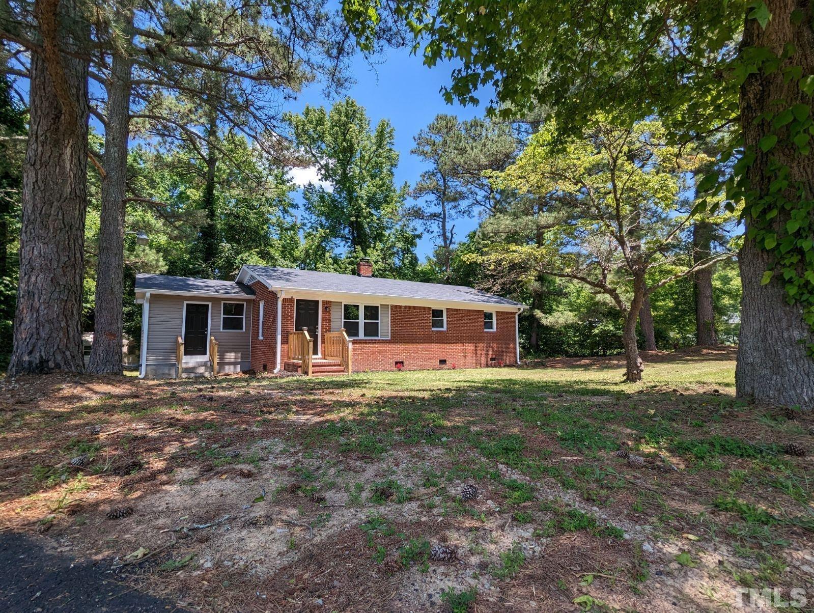 30 Alton Acres Subdivision Road Louisburg, NC 27549 - Photo 6 of 35 a front view of a house with a garden