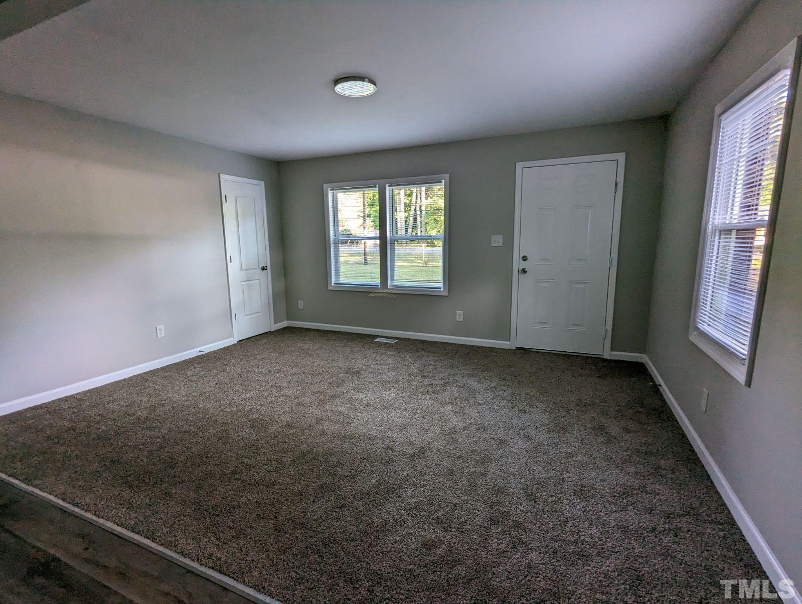 30 Alton Acres Subdivision Road Louisburg, NC 27549 - Photo 7 of 35 an empty room with windows