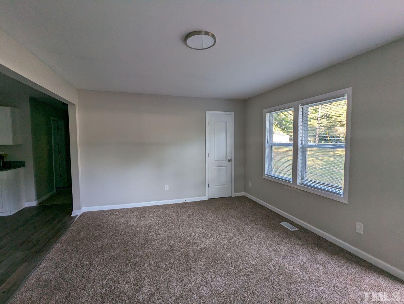 30 Alton Acres Subdivision Road Louisburg, NC 27549 - Photo 8 of 35 an empty room with windows