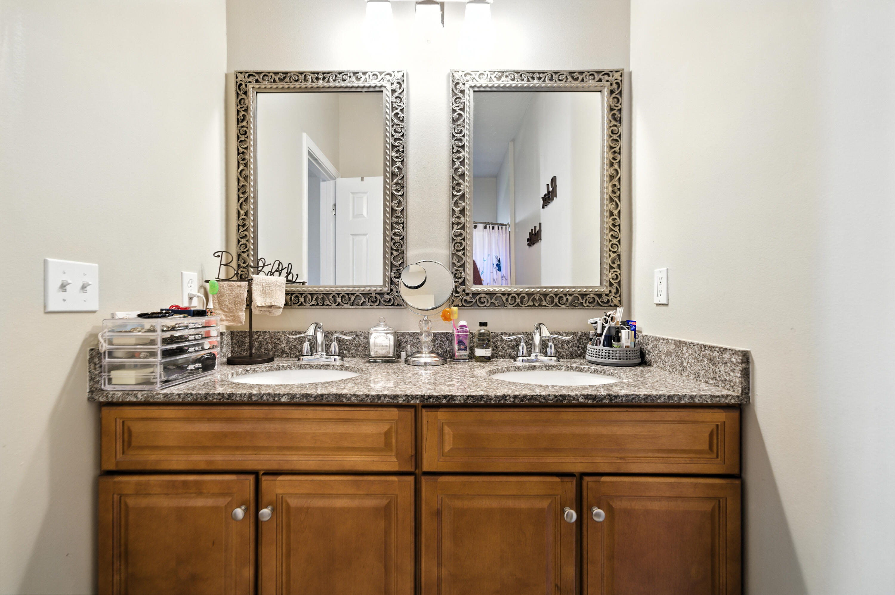 4629 Hermosa Road Crestview, FL 32539 - Photo 12 of 26 a bathroom with a granite countertop sink and a mirror