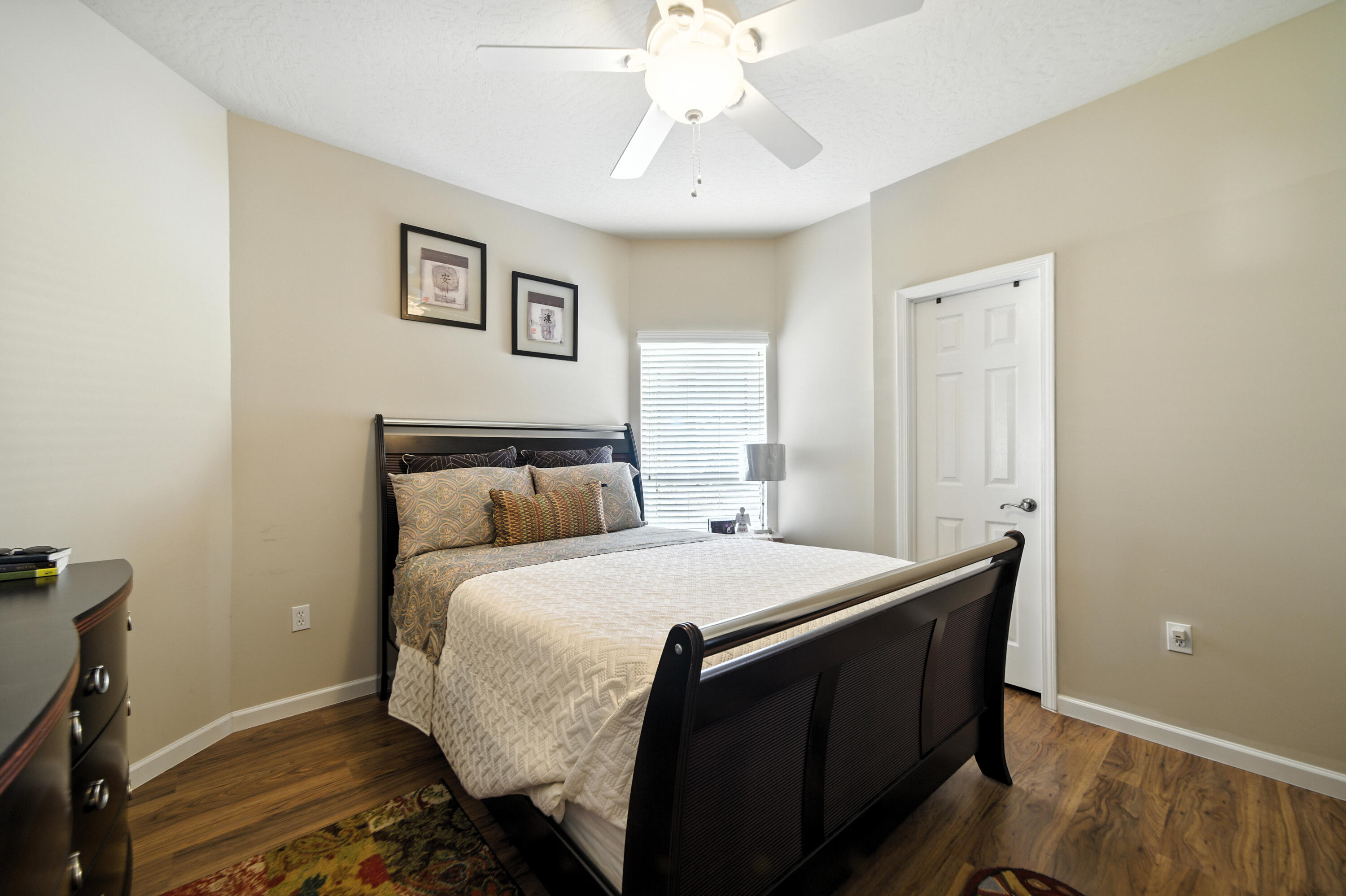 4629 Hermosa Road Crestview, FL 32539 - Photo 14 of 26 a bedroom with a bed and a chandelier