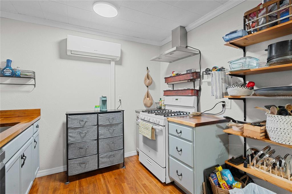 110 County Road 534 Bushnell, FL 33513 - Photo 12 of 60 a kitchen with cabinets appliances and a wooden floor