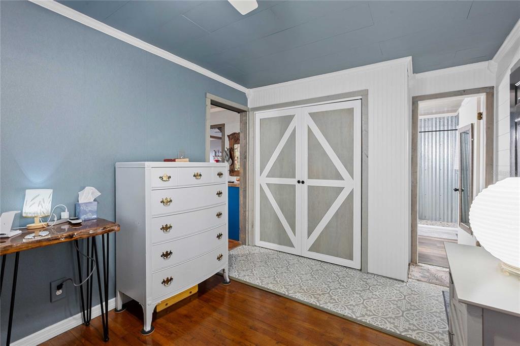 110 County Road 534 Bushnell, FL 33513 - Photo 17 of 60 a view of a bedroom with baby bed and cabinet