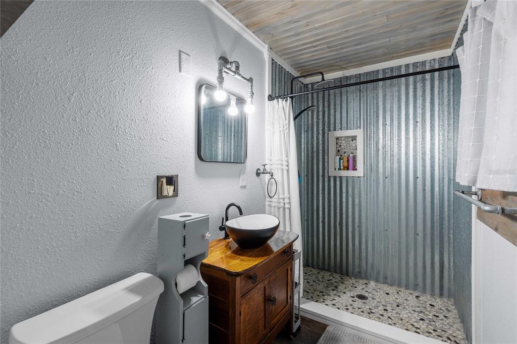 110 County Road 534 Bushnell, FL 33513 - Photo 2 of 60 a bathroom with a sink a toilet and shower