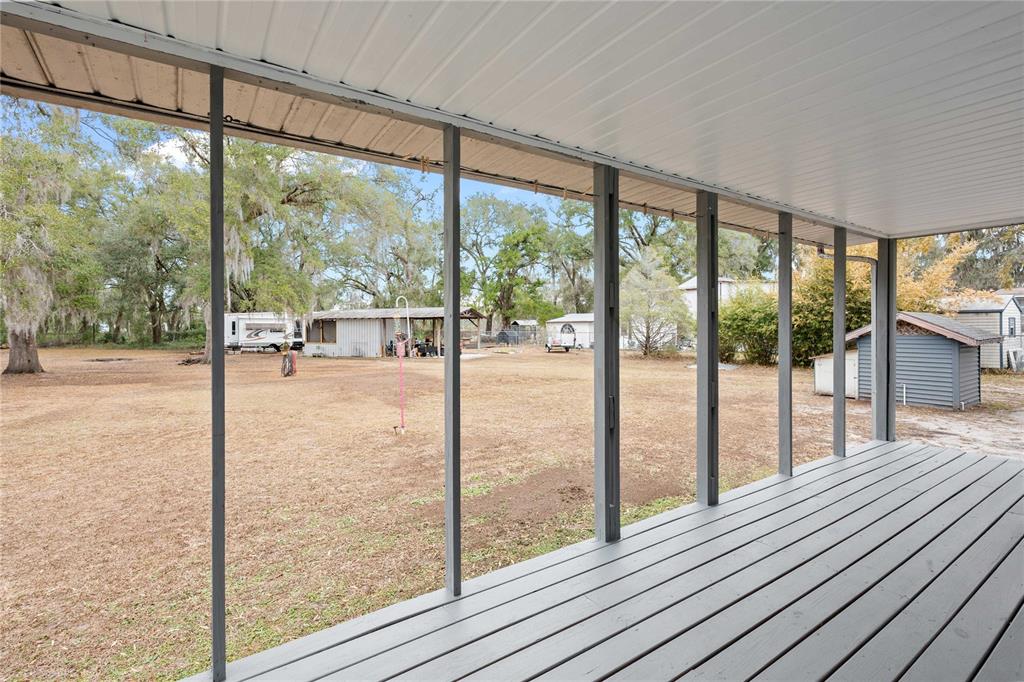 110 County Road 534 Bushnell, FL 33513 - Photo 26 of 60 a view of a room with wooden floor and windows