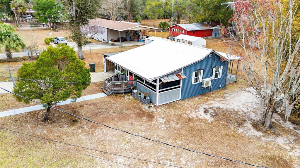 110 County Road 534 Bushnell, FL 33513 - Photo 28 of 60 a view of a house with a yard and sitting area
