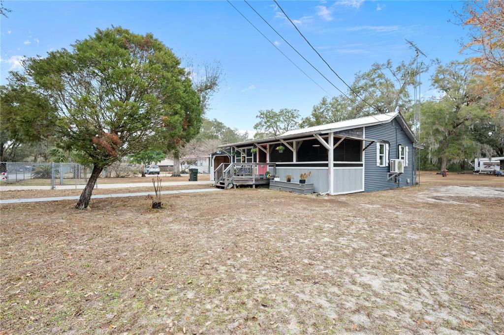 110 County Road 534 Bushnell, FL 33513 - Photo 39 of 60 a house with trees in the background
