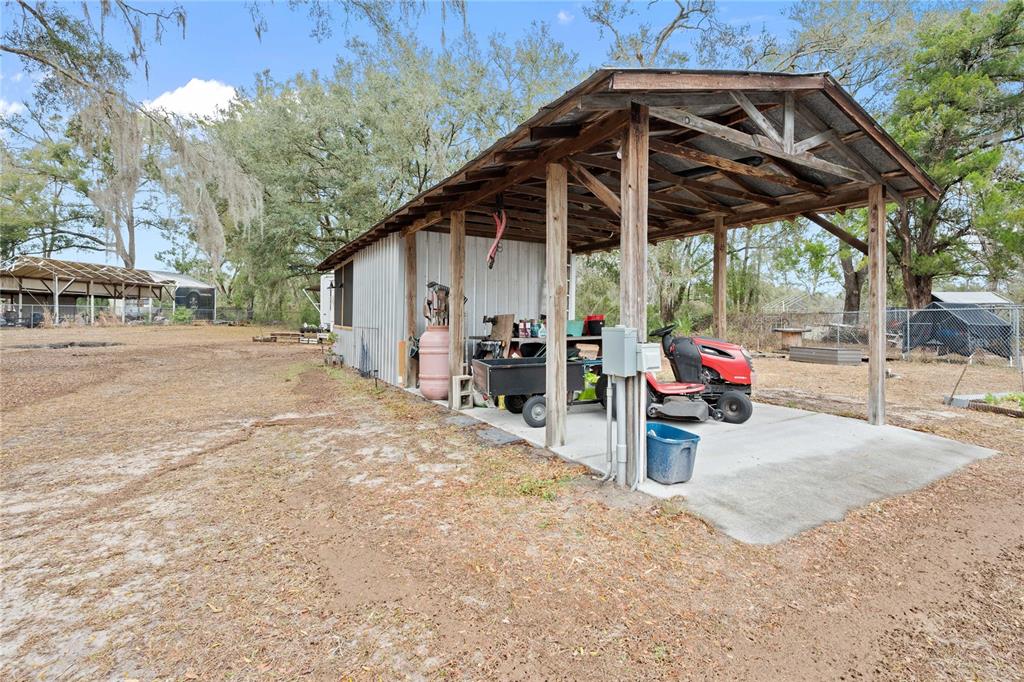 110 County Road 534 Bushnell, FL 33513 - Photo 42 of 60 a view of a chair and tables in the patio