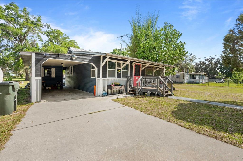 110 County Road 534 Bushnell, FL 33513 - Photo 46 of 60 a view of a house with a yard and sitting area