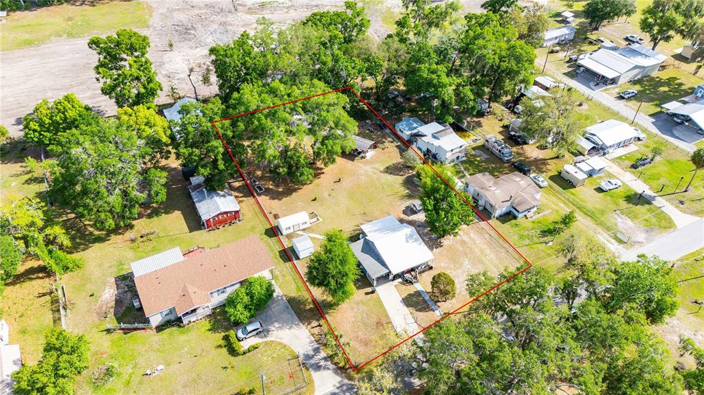 110 County Road 534 Bushnell, FL 33513 - Photo 55 of 60 an aerial view of residential house with swimming pool and garden