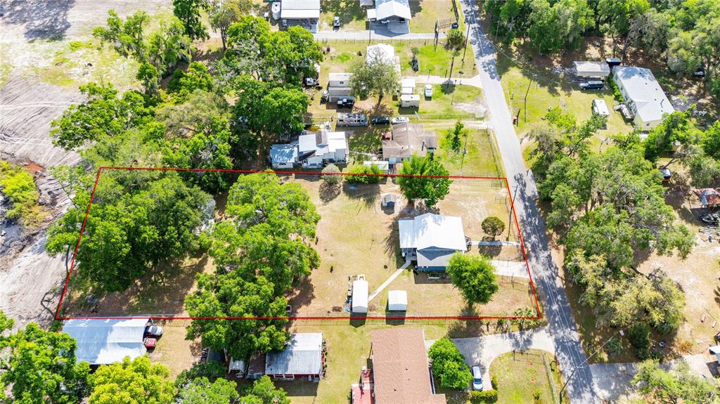 110 County Road 534 Bushnell, FL 33513 - Photo 56 of 60 an aerial view of residential houses with outdoor space and trees all around