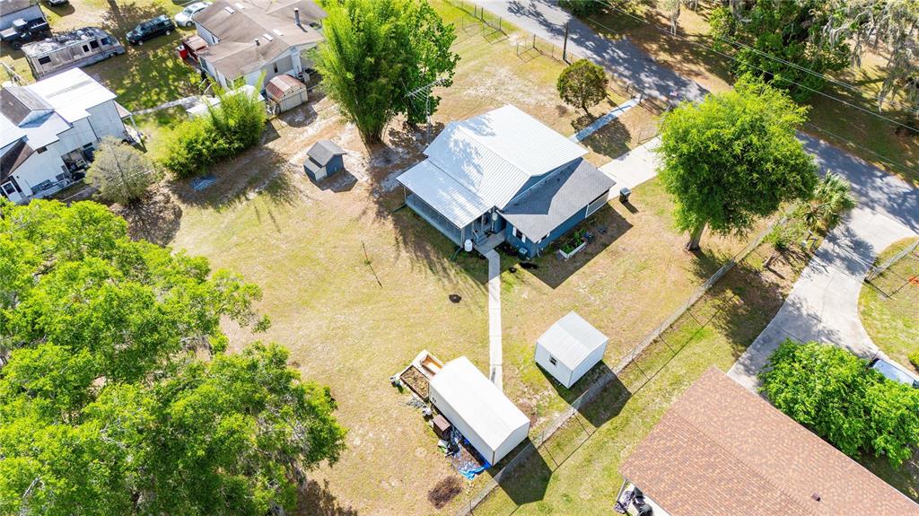 110 County Road 534 Bushnell, FL 33513 - Photo 58 of 60 an aerial view of a house with a yard and trees