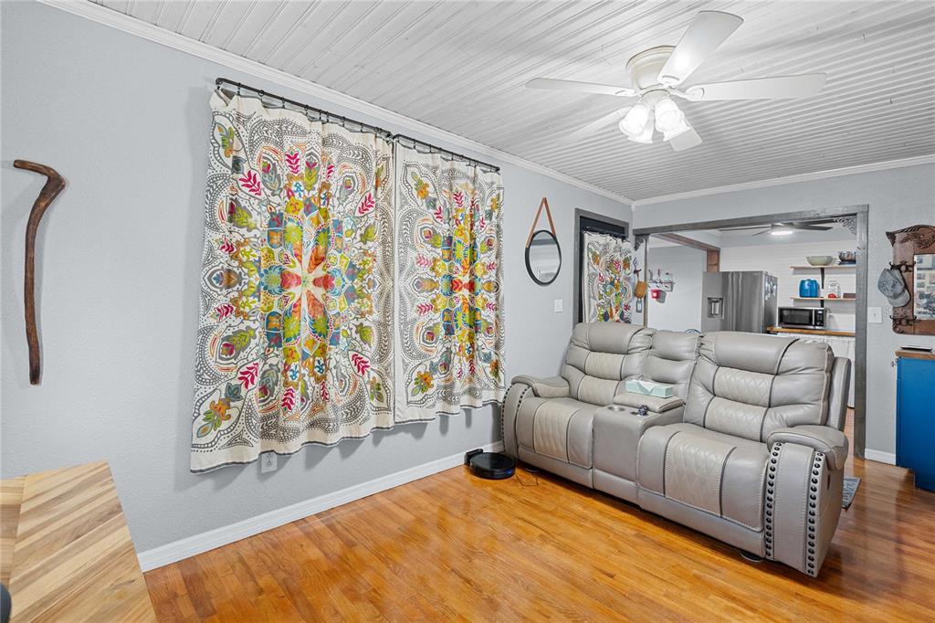 110 County Road 534 Bushnell, FL 33513 - Photo 9 of 60 a living room with furniture and a rug