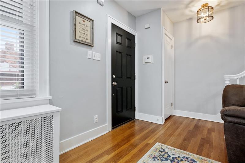 490 Mapleton Avenue Pittsburgh, PA 15228 - Photo 11 of 35 a view of livingroom with hardwood floor and hallway